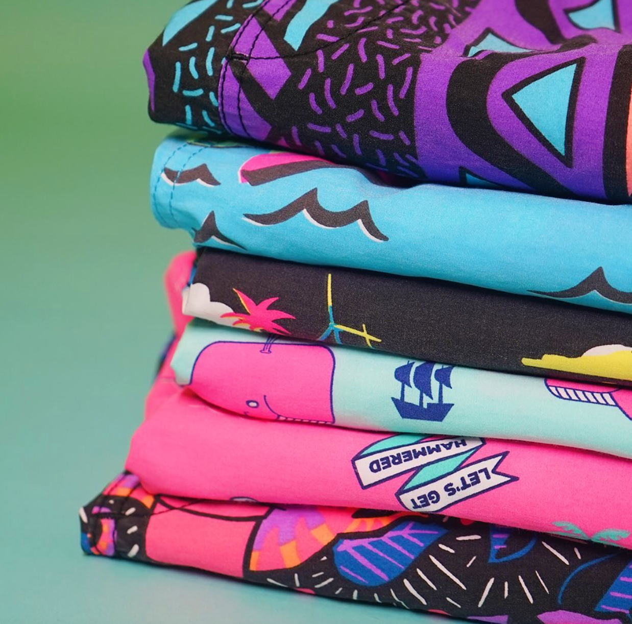 A stack of Party Pants hybrid swim shorts