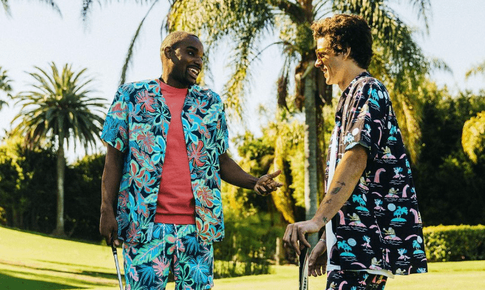 Two guys wearing men’s print button-down shirts at a golf course