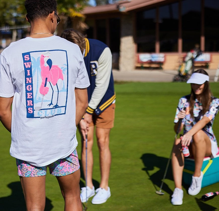 A group of friends golfing with a guy wearing the Swingers Mingo T-Shirt - White