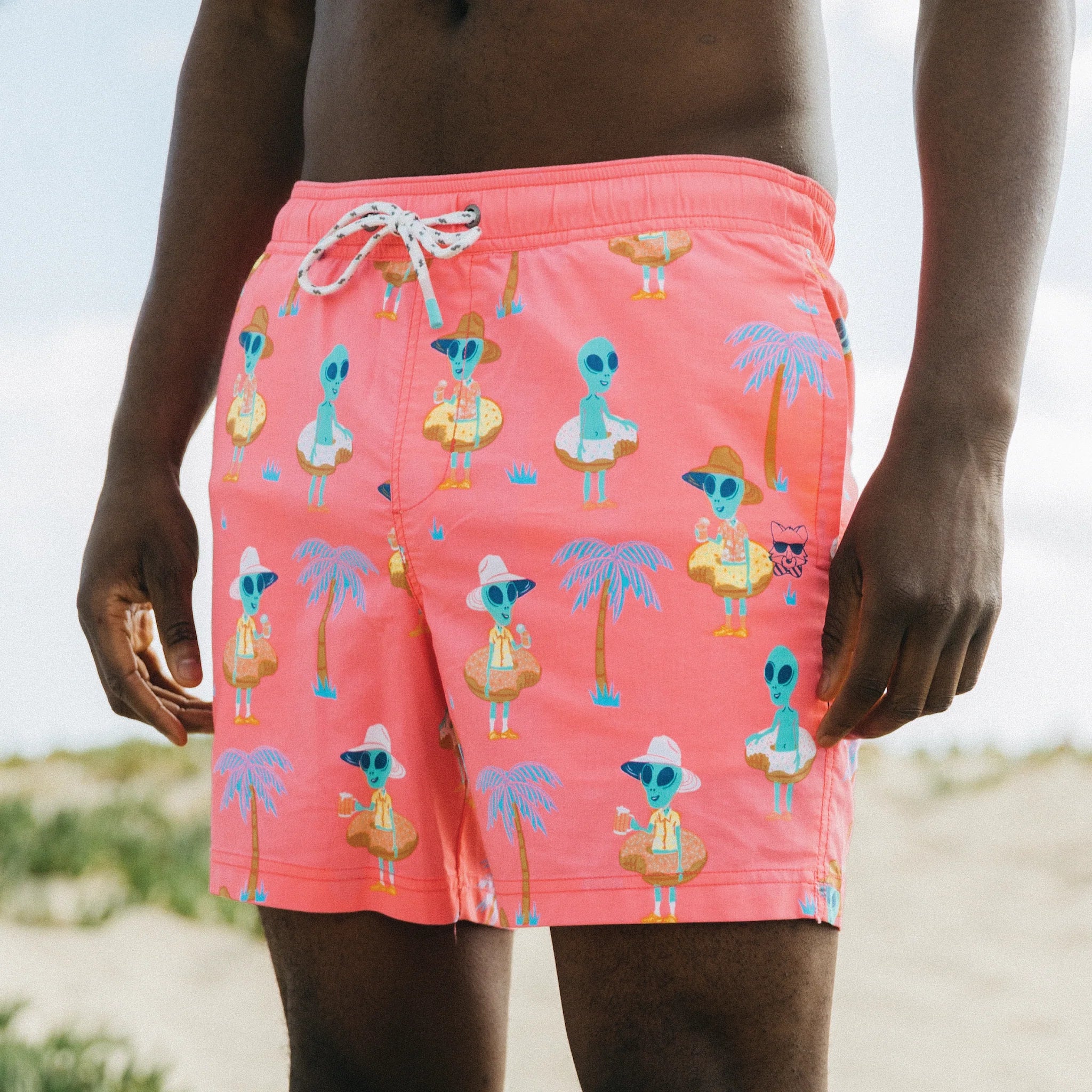 A guy wearing the Pool Fool Party Starter Short - Pink